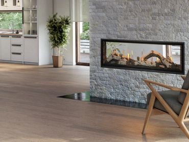 Modern living space with a sleek fireplace and wooden flooring.