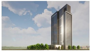 Modern high-rise building with reflective glass under a partly cloudy sky.