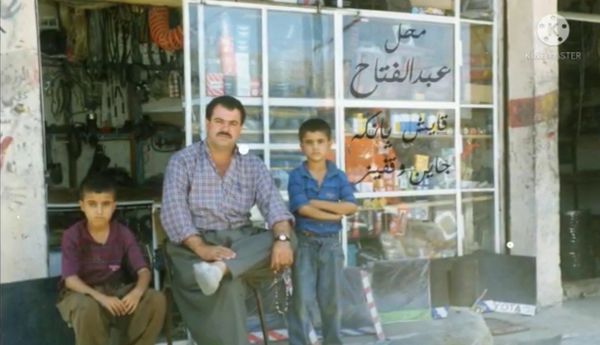 An old picture of my father, myself and my brother
١٩٩٧