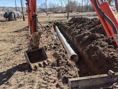 Installing an irrigation line.