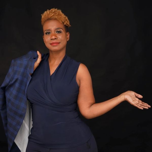 Expert realtor with a warm, approachable smile.