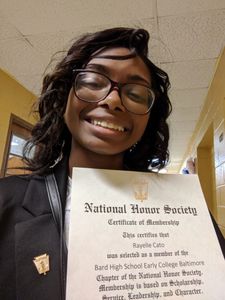 A girl standing and giving pause for picture