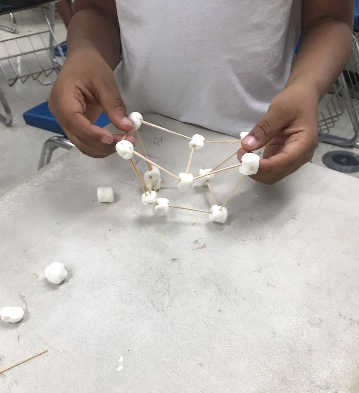 A kid playing toothpicks