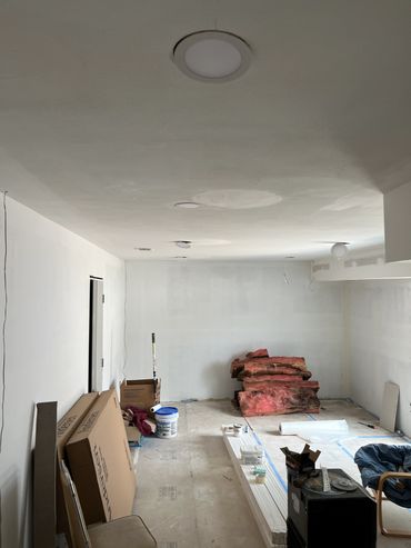 Room under renovation with insulation and construction materials.