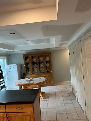 Kitchen with unfinished ceiling drywall.
