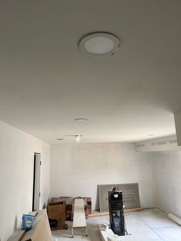 Room under renovation with construction materials.