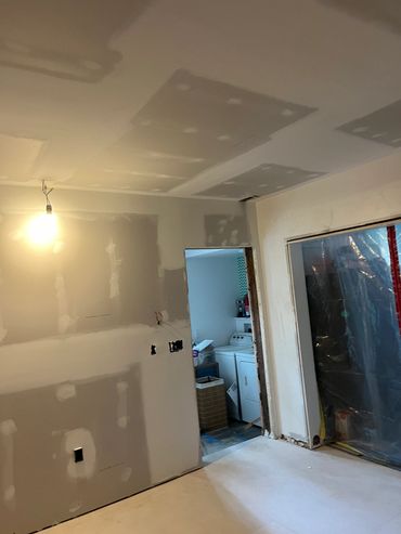 Room under construction with drywall.