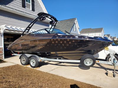 A vinyl wrapped boat with stars at the back part