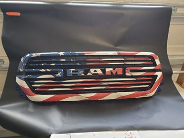 detached RAM grill with US flag skin on black background