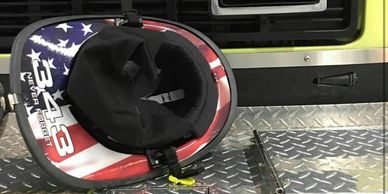 A fireman's helmet with US flag skin
