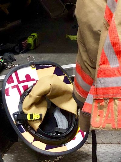 A firefighter's jacket and helmet