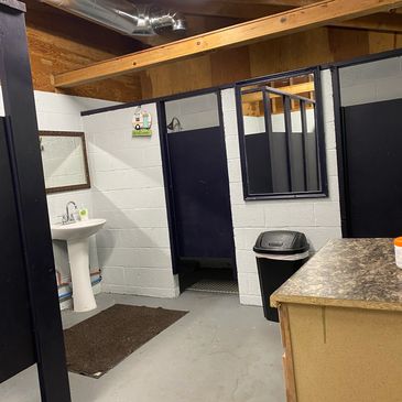 Image of bathroom with toilet and showers.