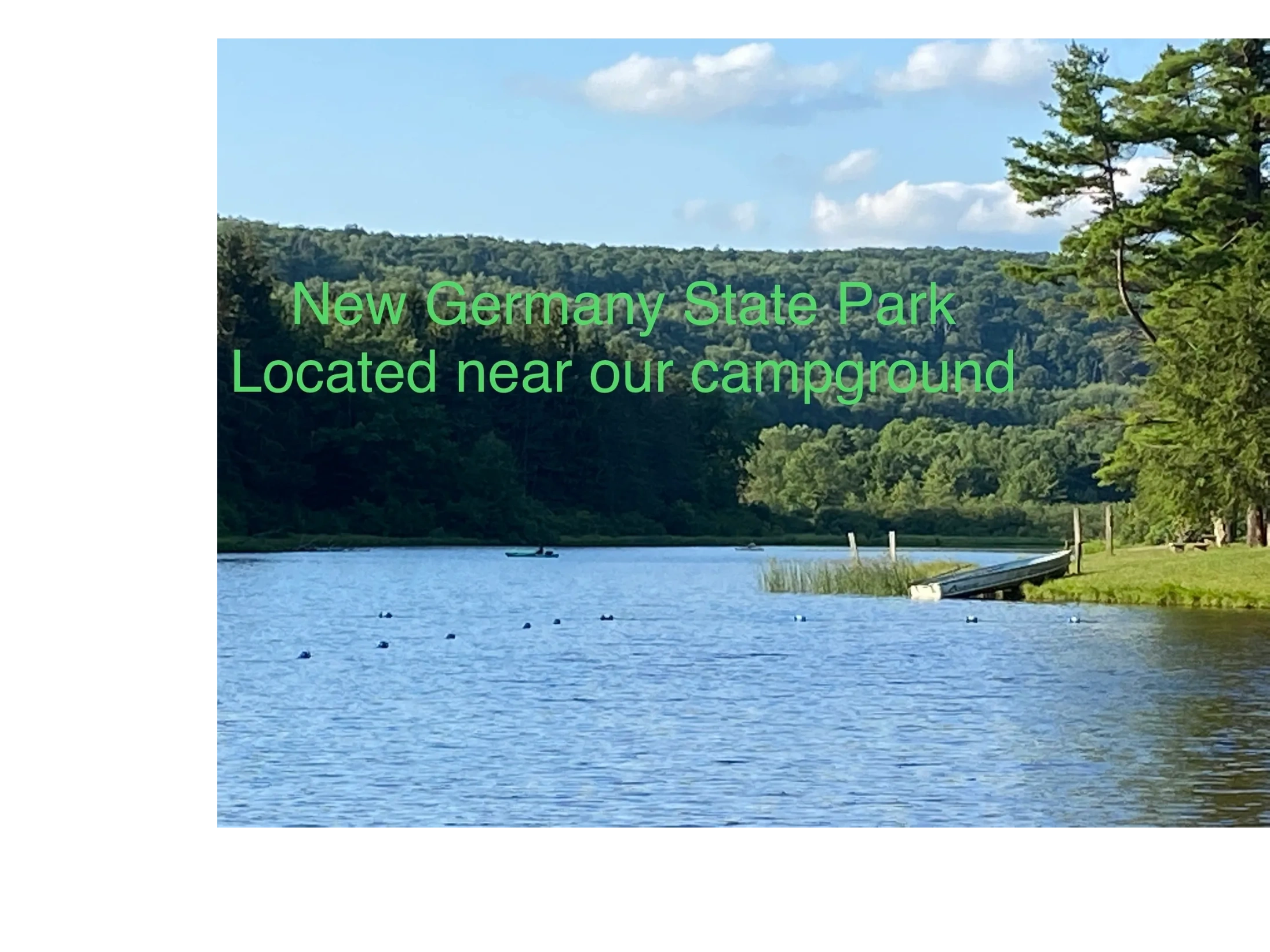 Picture of lake with trees surrounding. New Germany State Park