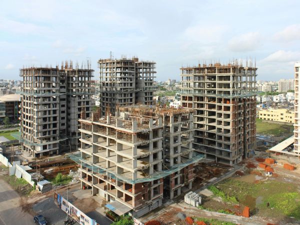 Under-construction high-rise buildings in an urban area.