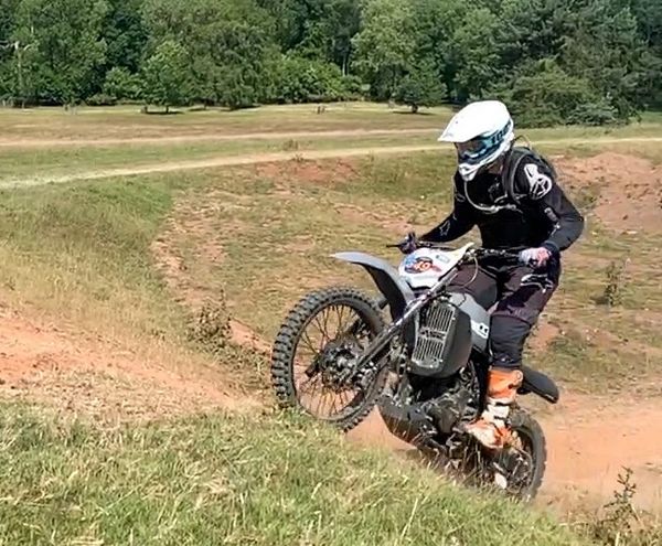 Custom Kawasaki KLR 650 being ridden at the ABR festival