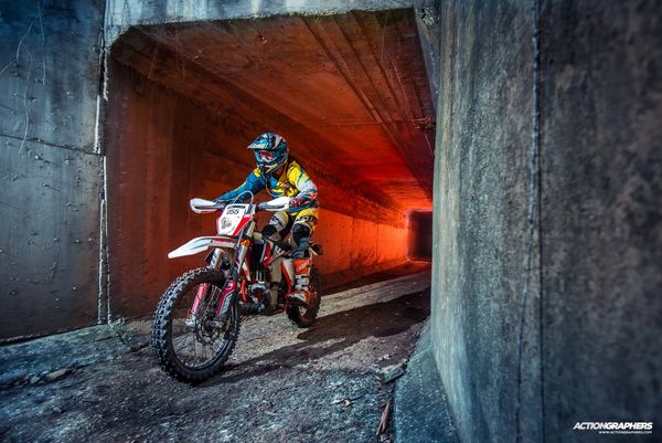 KTM 300 EXC riding through a runnel