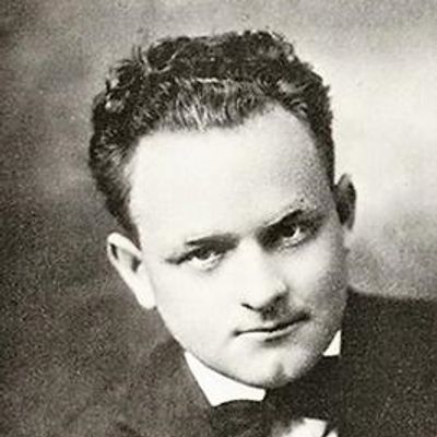 Black and white portrait of Ernest Holmes as a young man.