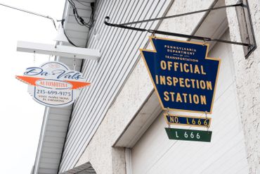 Da-Vals sign and Official Inspection Station sign