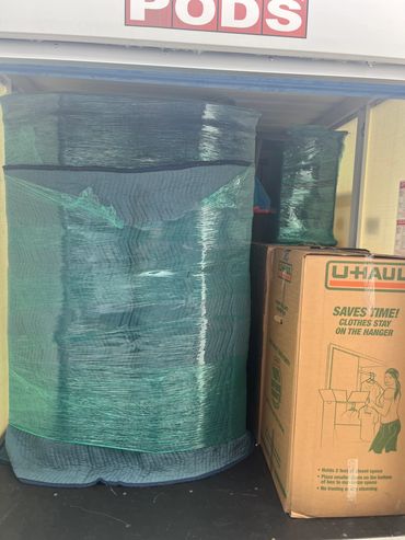 Packed moving supplies in a PODS container.