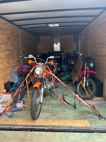 Motorcycles secured inside a trailer.