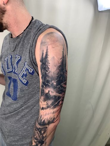 black and gray realism nature tattoo sleeve of mountains and forest pine trees