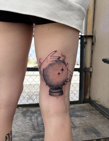 black and gray mystic crystal ball tattoo
