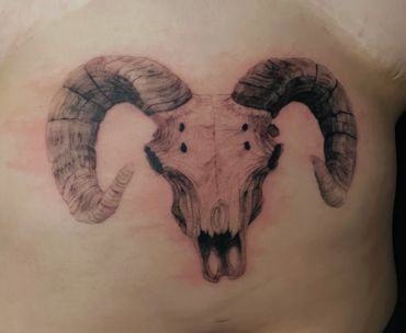 black and gray ram skull tattoo