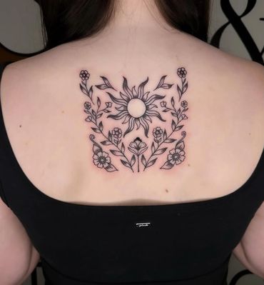 fineline sun and flowers back tattoo