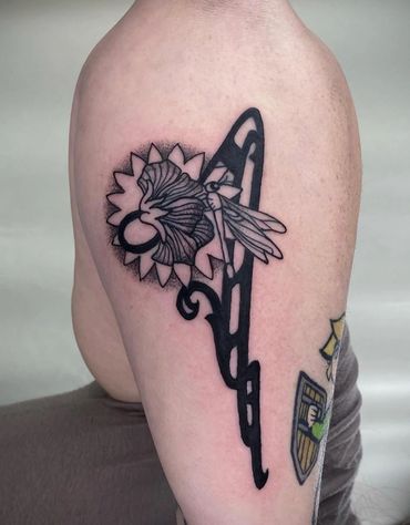 art deco aesthetic blackwork forearm tattoo