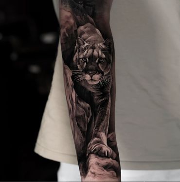 black and gray ultra realism cougar mountain lion tattoo