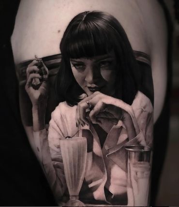 black and gray ultra realism tattoo of Uma Thurman as Mia Wallace drinking a milkshake Pulp Fiction