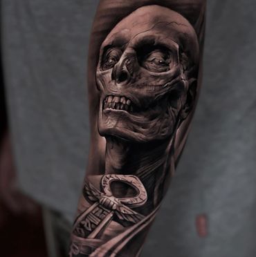 black and gray ultra realism tattoo of a mummy