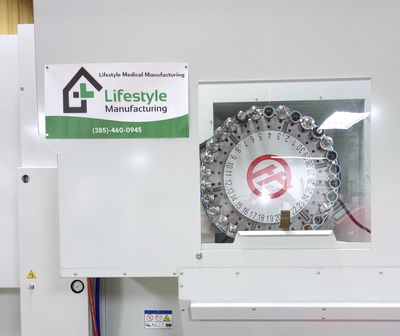 Medical manufacturing machine with Lifestyle Manufacturing branding.