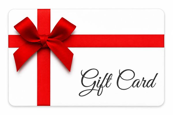 White gift card with a red ribbon and bow.