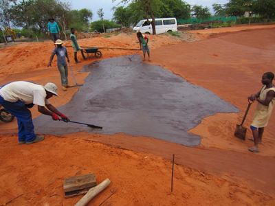 Workmen applying an Ecobond Membrane