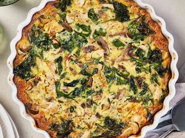 spinach mushrooms cheese quiche in a flaky pastry crust