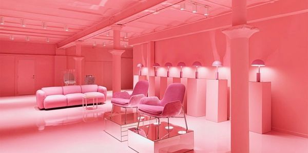 Modern pink-themed interior with stylish furniture.