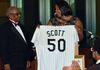 Colonel Eugene Scott receiving a White Sox jersey upon his retirement