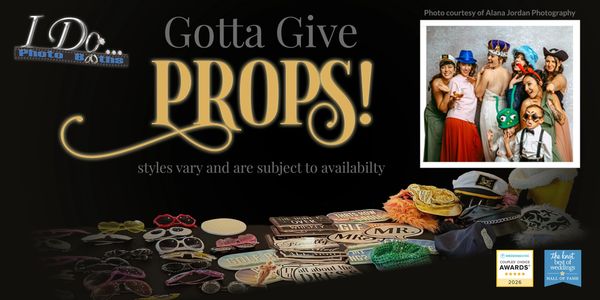 Photo booth props including hats and signs for celebrations.