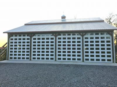 Custom fit these 8 panel doors into this loft/garage in Knoxville, TN.