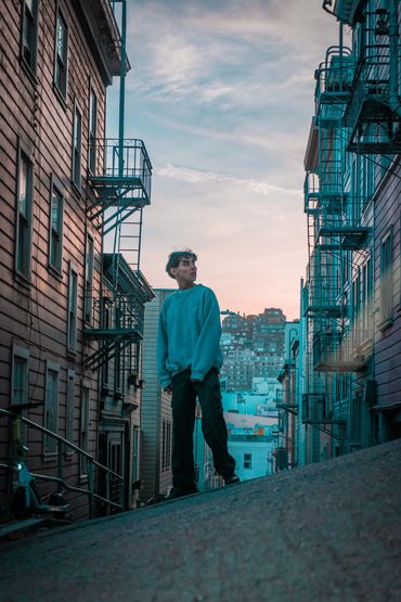 Reinert Webb Standing by buildings