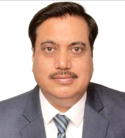 Professional portrait of a man in a suit and tie.