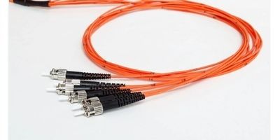 Six fiber optic cables coiled in a loop on a plain background.