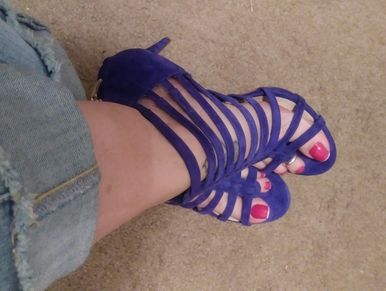 The red french tipped toed size 9 1/2 feet of Phoenix Stacy in some nice, strappy open toed purple stilettos.