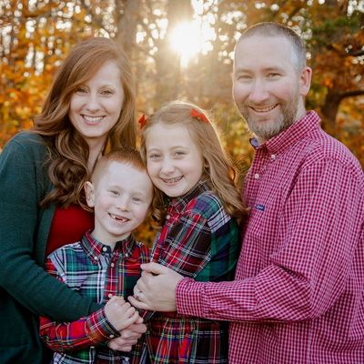 Happy family posing outdoors in autumn.