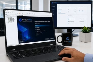 Person installing CyberArk Privileged Access Security on a Dell laptop in an office setting.
