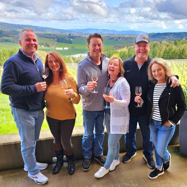 Group enjoying wine and the view at Penner-Ash. Newberg Oregon