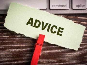 A paper strip with the word 'ADVICE' clipped by a red clothespin.