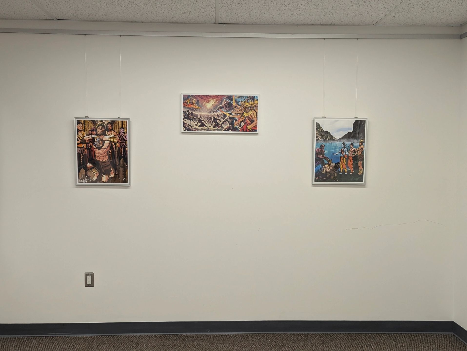 Visual representations of Hindu mythology by CV Sastry adorn the gallery walls.