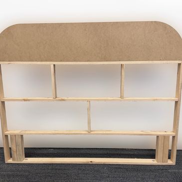 Wooden display shelf with multiple compartments against a white background.